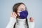 sick girl kid in protection mask during covid19 pandemic outbreak, protection