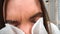 Sick girl sneezes in handkerchief home