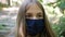 Sick Girl Wearing Protective Mask due Coronavirus Pandemic, Sad Child Isolated in Park, Bored Unhappy Teenager Kid Not Playing