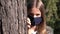 Sick Girl Wearing Protective Mask due Coronavirus Pandemic, Sad Child Isolated in Park, Bored Unhappy Teenager Kid Not Playing