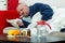 Sick man in bed with drugs and fruit on table