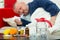 Sick man in bed with drugs and fruit on table