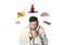 SIck man with cup of hot drink surrounded by different drugs and products for illness treatment on white background