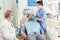 Sick man preparing for tooth surgery while nurse putting medical oxigen mask