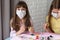 A sick quarantined child paints Easter eggs for the holiday