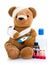 Sick teddy with medicine