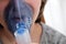 Sick teengae girl using a nebulizer