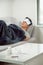 sick wasted man lying in sofa suffering cold and winter flu virus