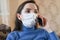 Sick woman calling to the doctor. Close-up portrait. Coronavirus symptoms concept