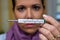 The sick woman with flu and fever thermometers