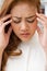 Sick woman suffers from headache, migraine, hangover, stress