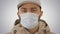 Sick young man handsome wearing medical mask on gradient background.