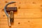 Sickle and hammer on a wooden table.