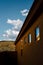 Side of Adobe Home in Desert Landscape