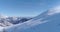 Side aerial follow people skier alpine skiing in winter snowy mountain ski track field in sunny day.Italy Alps mountains