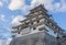 The side angle of Karatsu japanese Castle Karatsu-jo Located on hill with blue sky and clouds