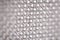 Side angle of metal cheese grater, abstract pattern