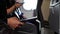 Side closeup view of people hands holding smartphones and sitting in an airplane