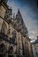 Side column of the gothic Vysehrad cathedral in Prague featuring beautiful windows and stone wall and pillars