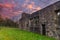 Side Elevation of the Old Semple Ruins at sunset with blazing red sky in Renfrewshire Scotland