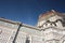 Side facade and details of the cathedral of the famous cathedral of Florence in Italy, on a beautiful day from the clear spring