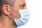 Side face head view of man wearing medical surgical disposable mask