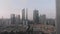 Side flight of the drone. In the frame of residential area, skyscrapers and Canton Tower. Office buildings. Sunrise in Guangzhou,