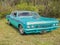 Side and front view of a beautifully restored and rebuilt 1965 Chevrolet convertible