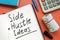 Side hustle ideas list and cash on the desk.