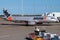 Side of Jetstar Airbus A320 airliner taxiing to terminal gate on tarmac at Brisbane airport plane ready for unloading and loading