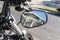 Side mirror of a motorcycle and a reflection of a house in the mirror in California