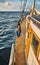 Side of an old sailing schooner at sunset