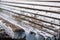 Side perspective view of an old weathered wooden bench