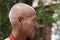 Side portrait of an old Tibetan Buddhist monk