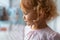 Side portrait of thoughtful child girl near window. Reflection of face on glass.