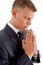 Side pose of praying businessman