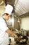 Side profile of a chef cooking food. Conceptual image