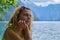 Side profile of a contemplative woman at the shore of lake Konigssee, Bavaria, Germany. Mood, portrait, nature, outdoor,