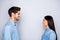 Side profile photo of cheerful charming beautiful couple of two people together setting eye contact speaking with each