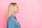 Side profile photo of good mood lovely woman with straight hairdo wear blue blouse look empty space isolated on pink