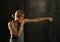 Side profile view of young athletic women boxing