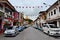 Side street with parked cars leading to Waterfront assembly building Kuching Sarawak Malaysia