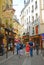 Side streets of Paris with crowd walking leisurely