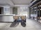 Side table to the kitchen island with designer chairs in a contemporary style kitchen with green walls