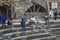 Side, Turkey - April 19 - 2019: A group of tourists resting and taking pictures on the steps of the ancient amphitheater