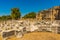 SIDE, TURKEY: Nympheum fountain in the city of Side on a sunny summer day on the background of the blue sky