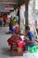 Side Vendor selling fruits & pickled product along the outdoor corridor of Bogyoke Market