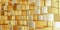 side view of abstract background of extruded gold square