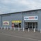 Side View of ANJOU DEPOT Brand on Front of french Store Facade with brand signage