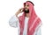 Side view of an arab saudi emirates man using a smart phone.